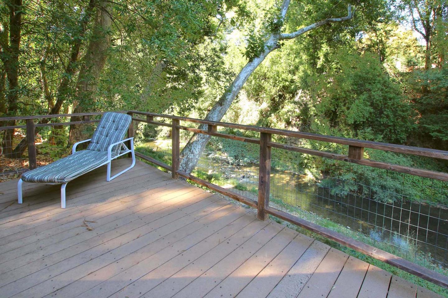 220 Shadowbrook Road Ben Lomond, CA 95005 - Photo 6 of 24 a porch with a bench next to a yard