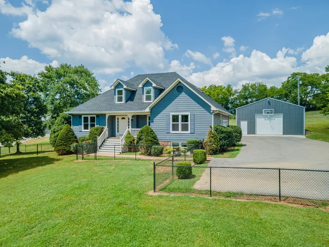 a front view of house with yard and green space