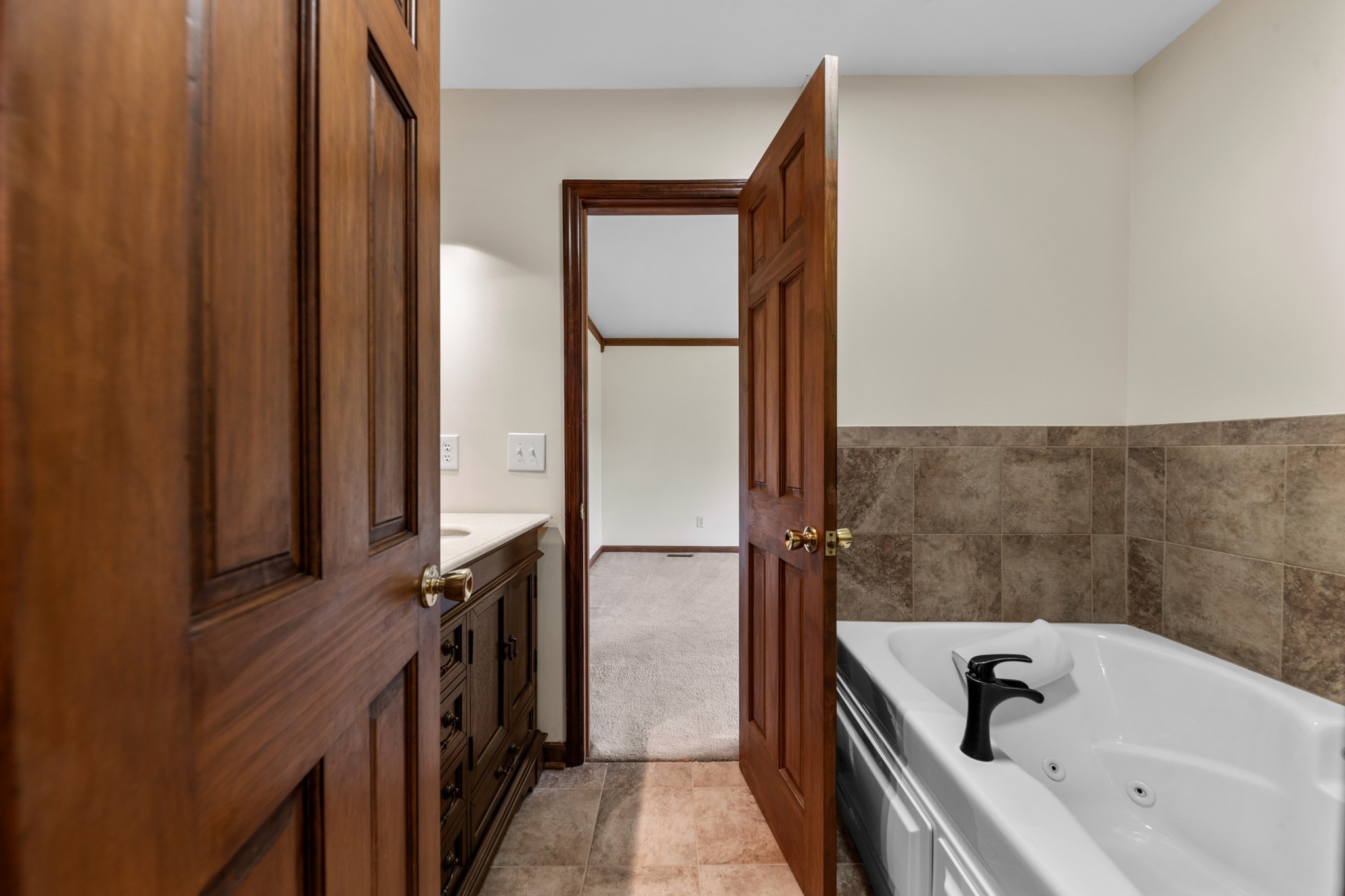 1056 South Cross Bridges Road Mount Pleasant, TN 38474 - Photo 16 of 30 a bathroom with a tub a sink and wooden floor