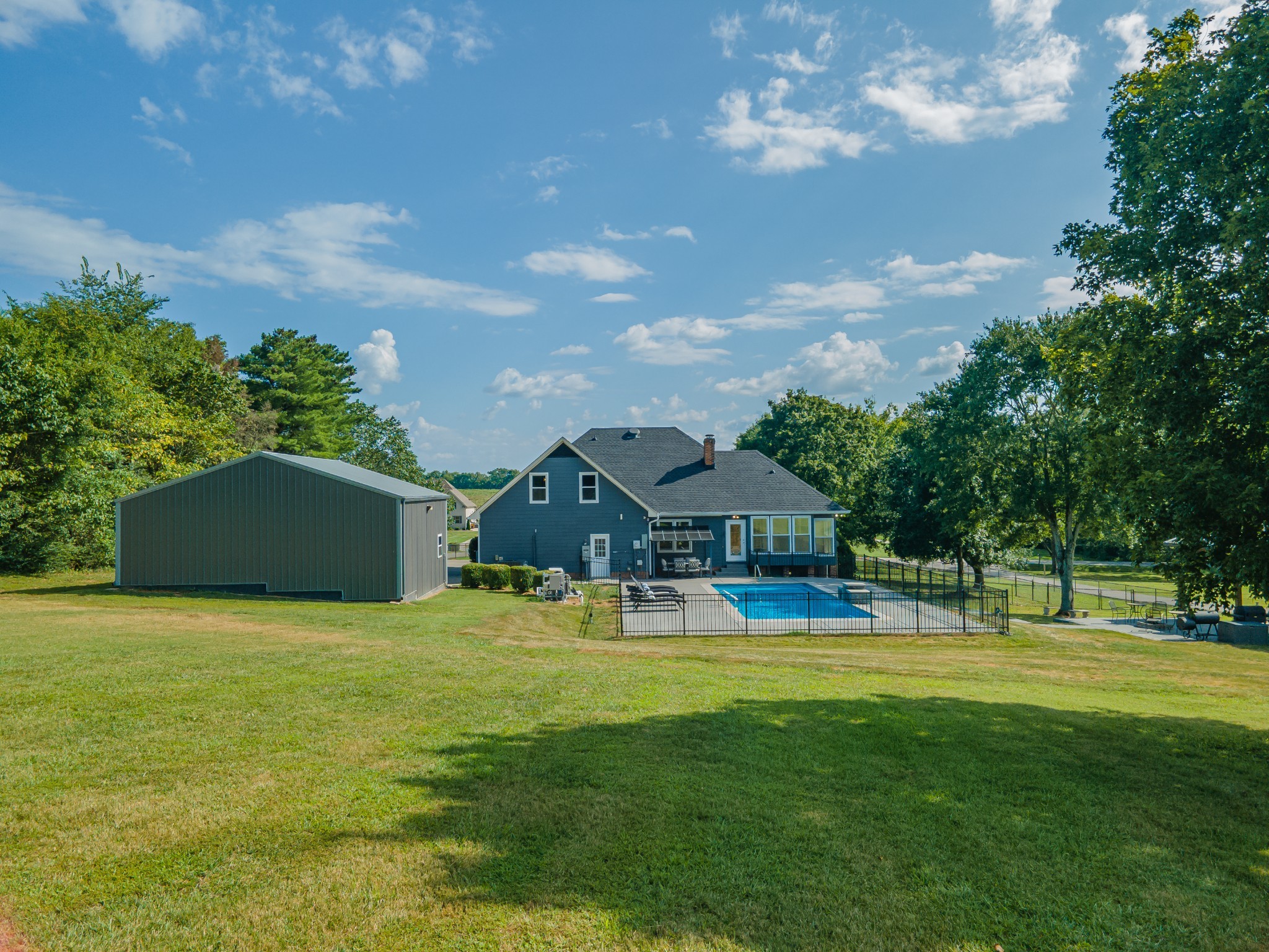 1056 South Cross Bridges Road Mount Pleasant, TN 38474 - Photo 2 of 30 a view of a house with a big yard and palm trees