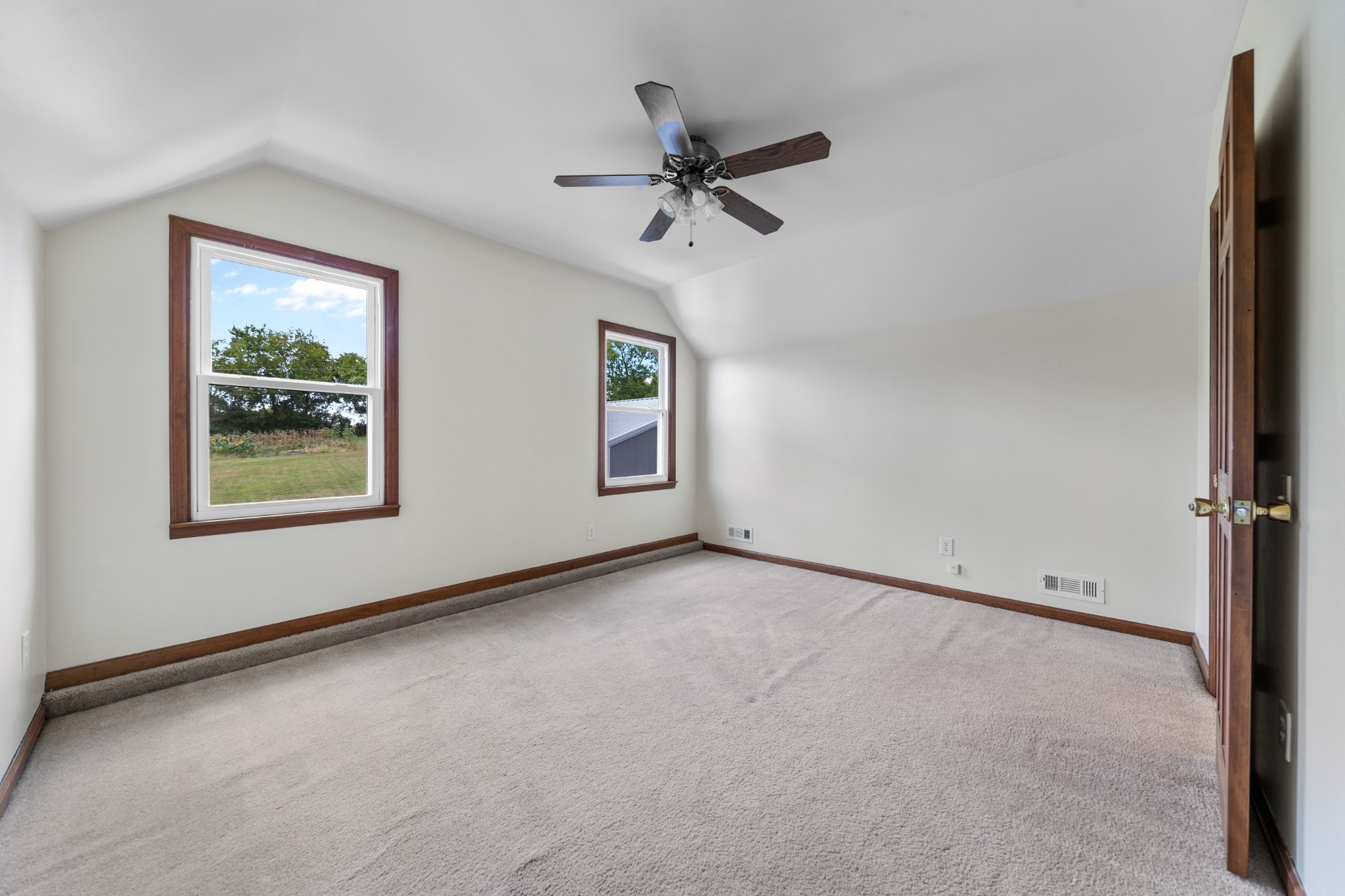 1056 South Cross Bridges Road Mount Pleasant, TN 38474 - Photo 23 of 30 an empty room with windows and fan