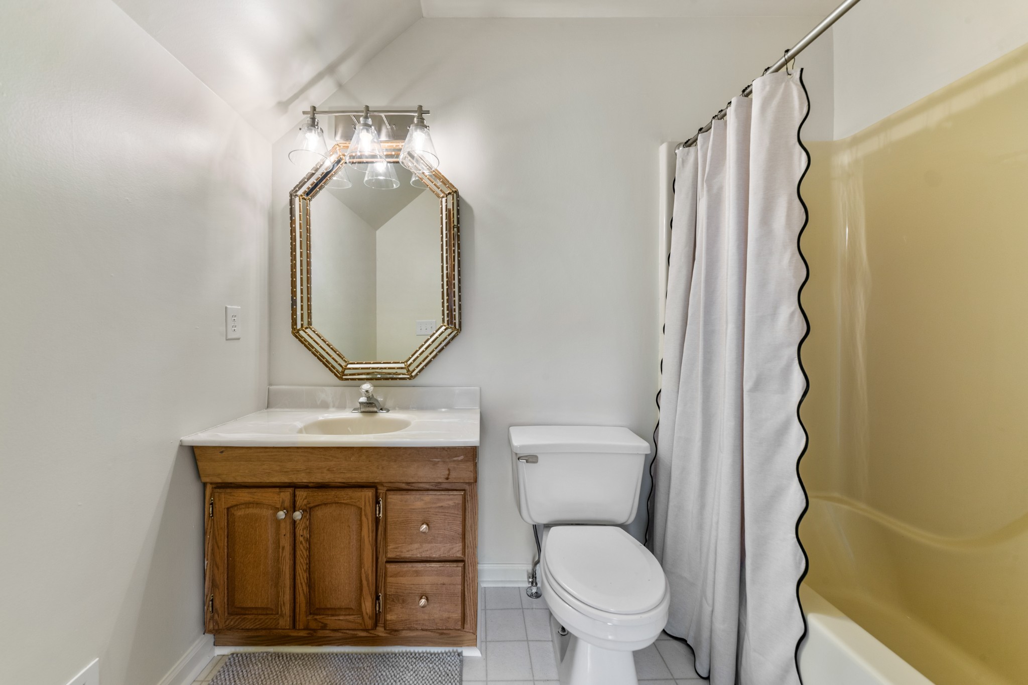1056 South Cross Bridges Road Mount Pleasant, TN 38474 - Photo 24 of 30 a bathroom with a toilet sink and mirror