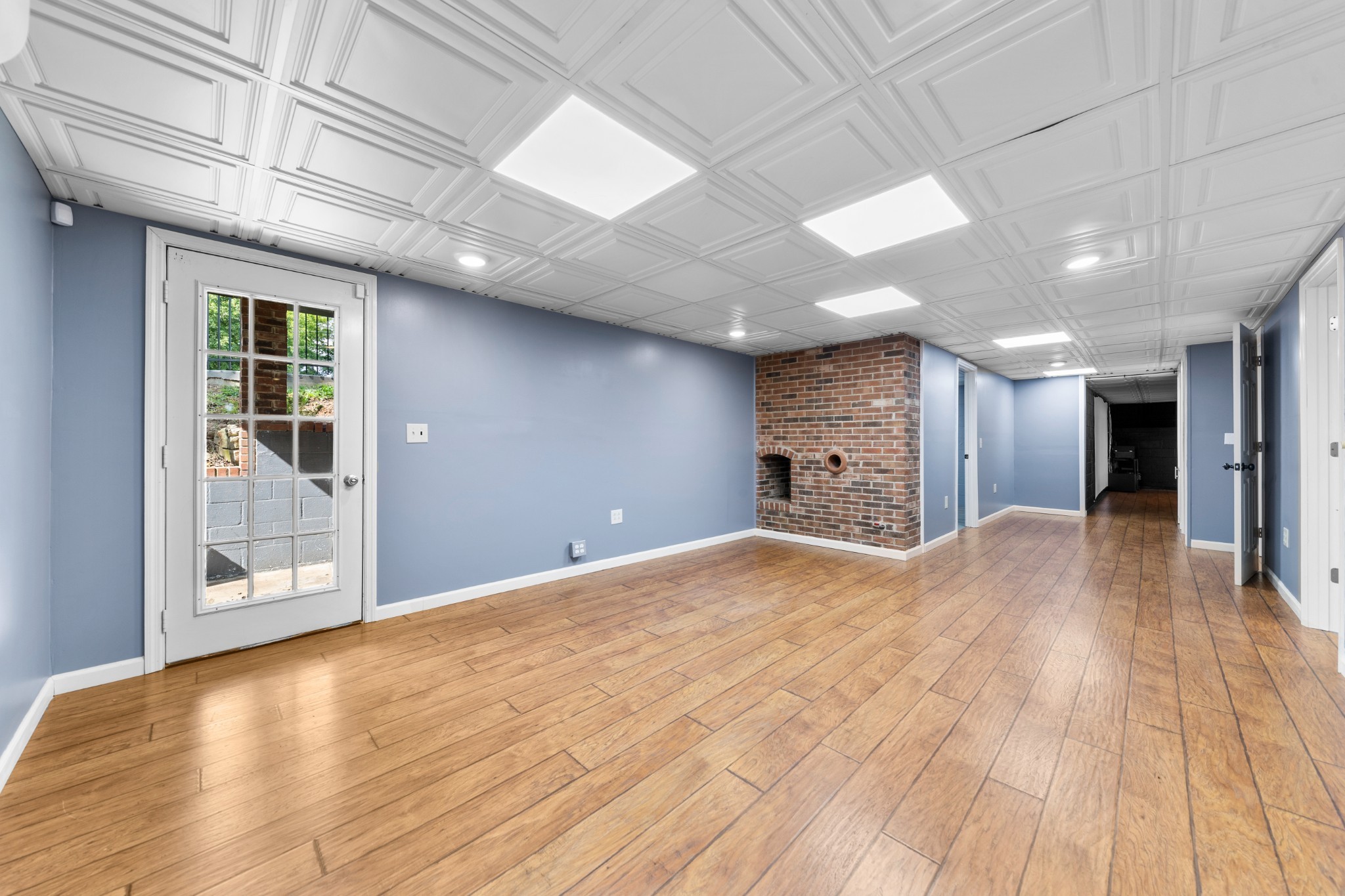 1056 South Cross Bridges Road Mount Pleasant, TN 38474 - Photo 26 of 30 a view of an empty room with wooden floor and a window