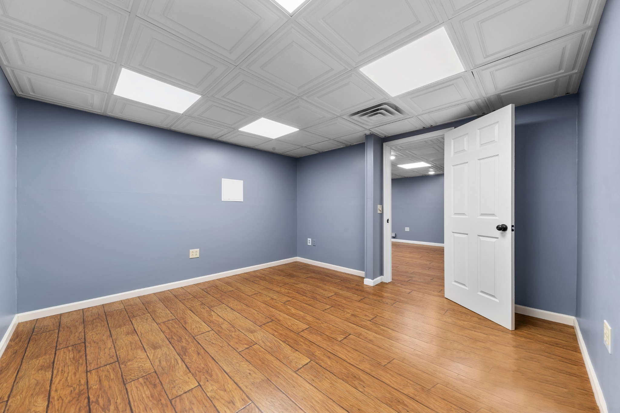 1056 South Cross Bridges Road Mount Pleasant, TN 38474 - Photo 28 of 30 a view of empty room with wooden floor