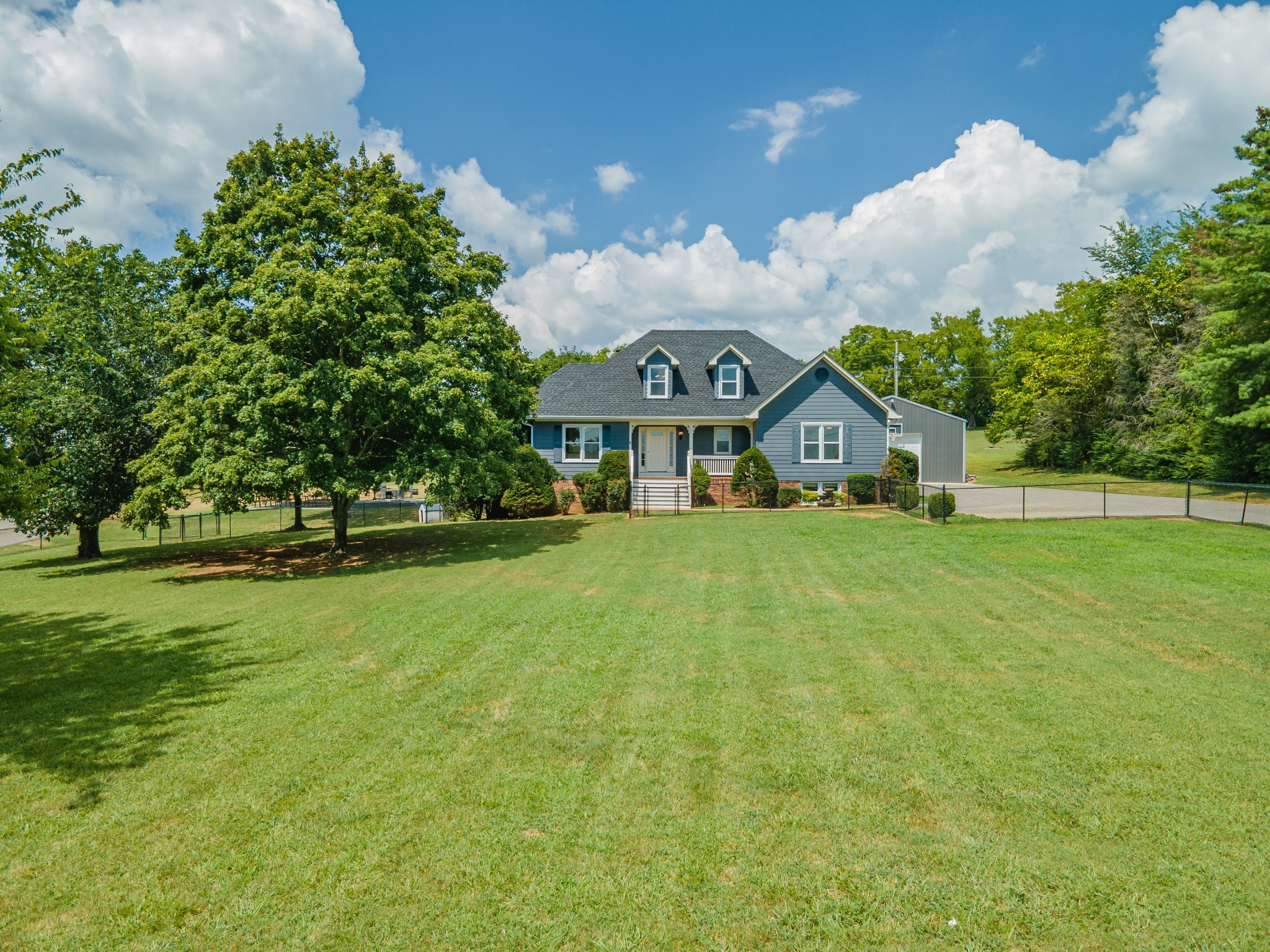 1056 South Cross Bridges Road Mount Pleasant, TN 38474 - Photo 29 of 30 a front view of a house with garden