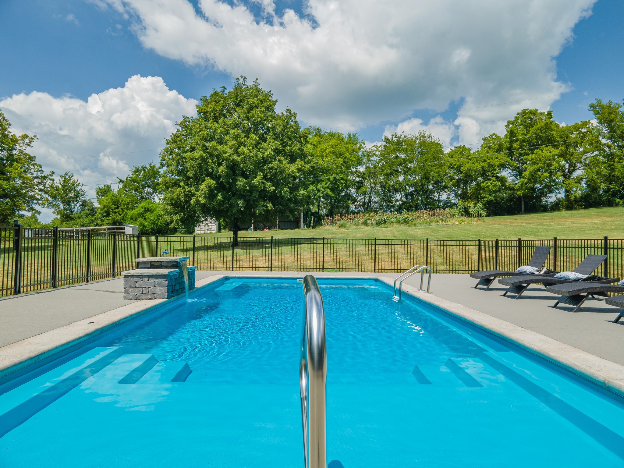 1056 South Cross Bridges Road Mount Pleasant, TN 38474 - Photo 3 of 30 a view of a swimming pool with a patio and a yard