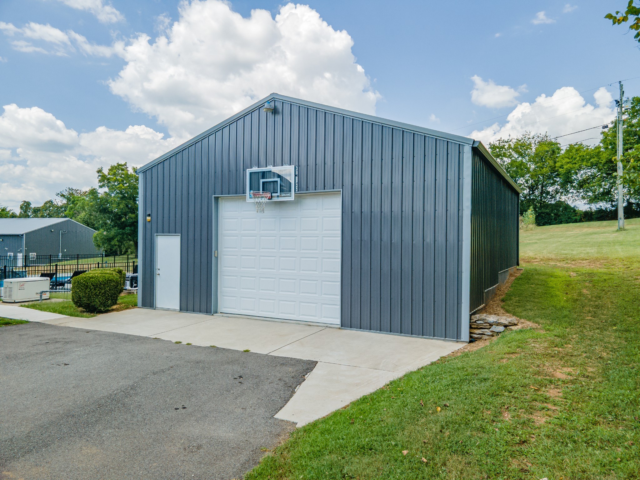 1056 South Cross Bridges Road Mount Pleasant, TN 38474 - Photo 6 of 30 a backyard of a house with plants and barbeque oven