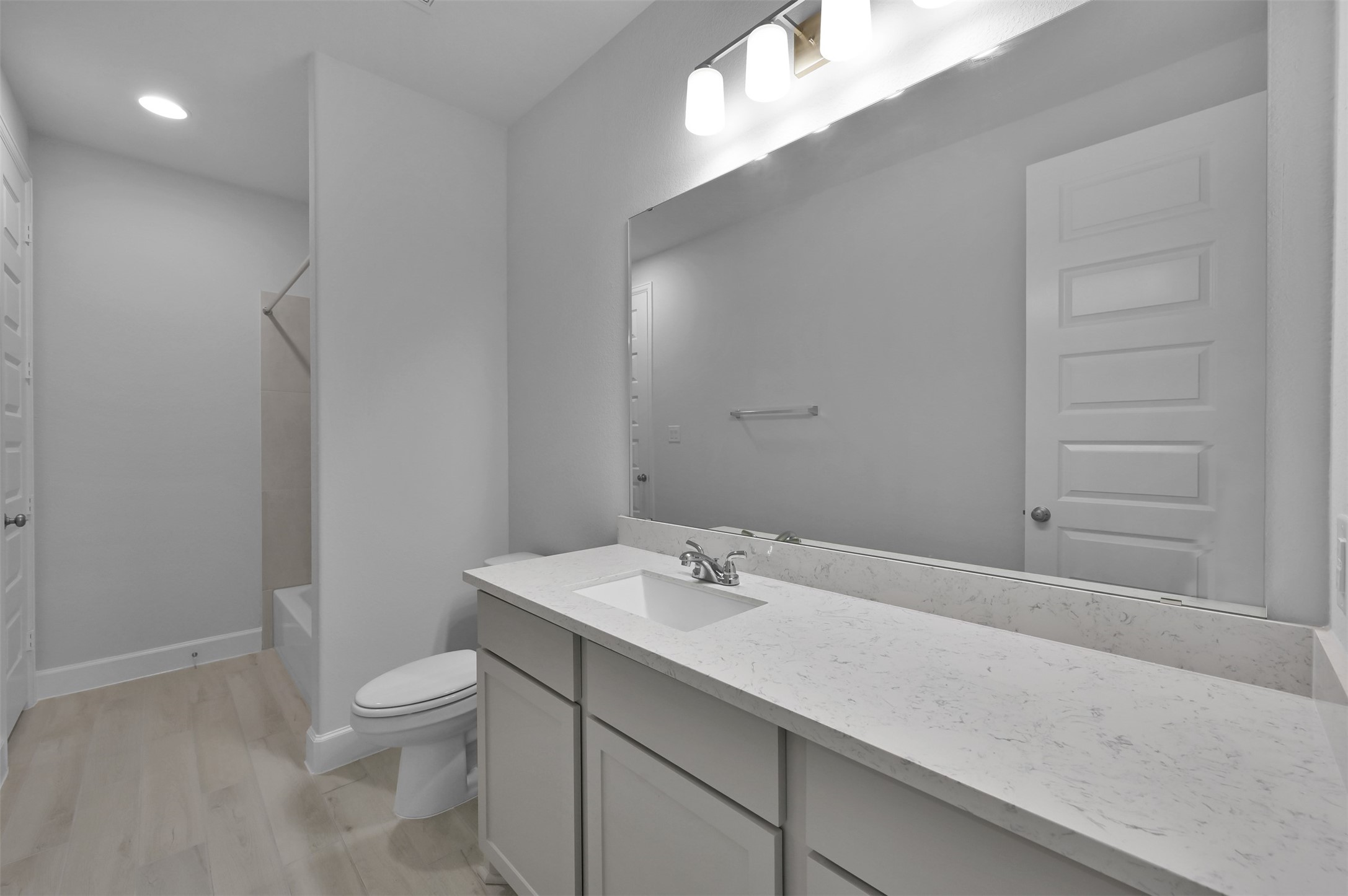 15715 Autumn Sun Conroe, TX 77302 - Photo 19 of 23 a bathroom with a sink a toilet and vanity