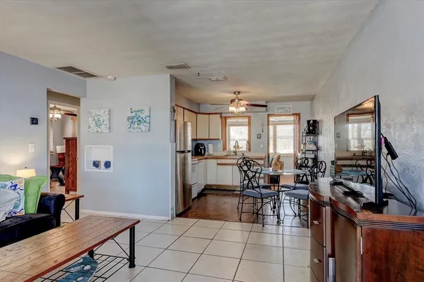 a view of a dining room with furniture and a livingroom