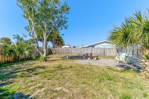 a view of a house with swimming pool and sitting area