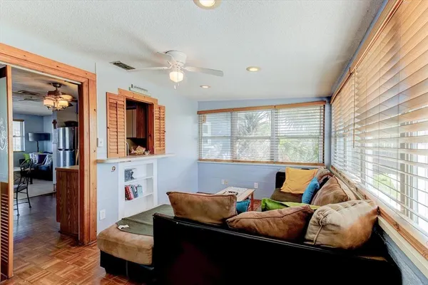 a living room with furniture and a large window