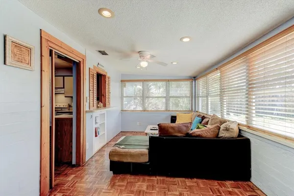 a living room with furniture and a window