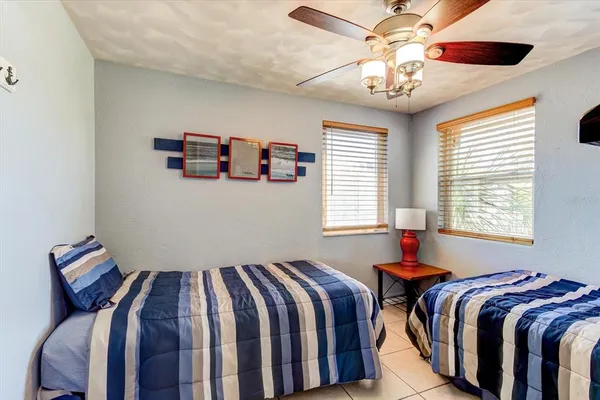 a bedroom with bed and a window