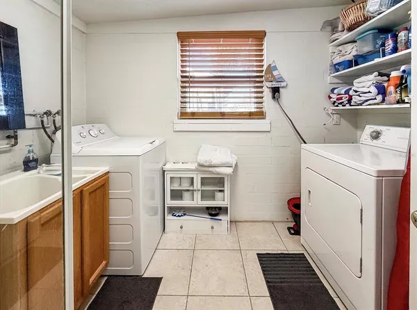 a utility room with dryer and washer