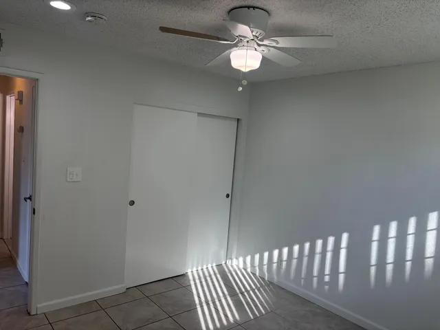 a bathroom with a shower and a sink