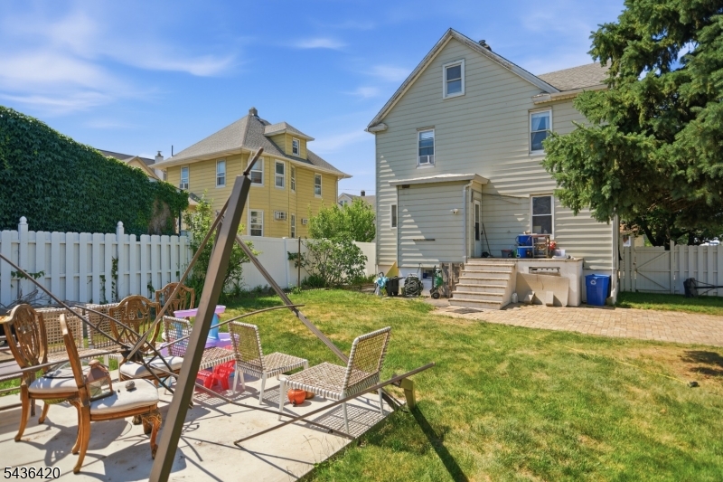33 Pulaski Place Hackensack, NJ 07601 - Photo 30 of 31 a backyard of a house with table and chairs