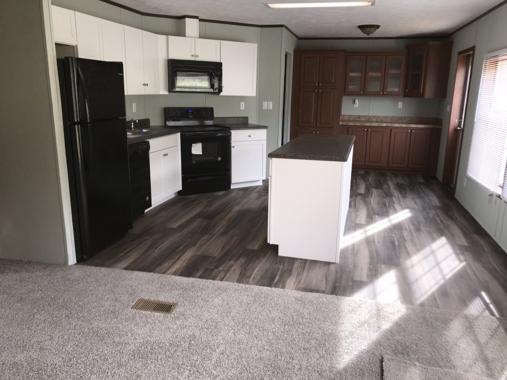 157 Buckner Road Philadelphia, TN 37846 - Photo 11 of 30 a kitchen with stainless steel appliances a refrigerator and a stove top oven