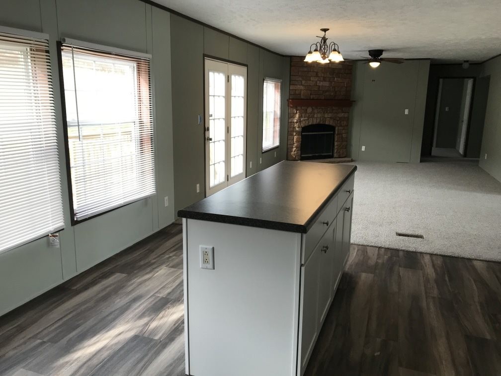 157 Buckner Road Philadelphia, TN 37846 - Photo 13 of 30 a kitchen with stainless steel appliances granite countertop a sink a stove and a refrigerator