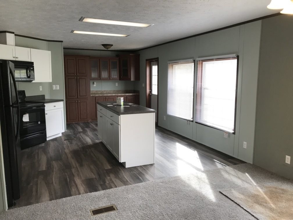 157 Buckner Road Philadelphia, TN 37846 - Photo 4 of 30 a kitchen with a stove a refrigerator and cabinets