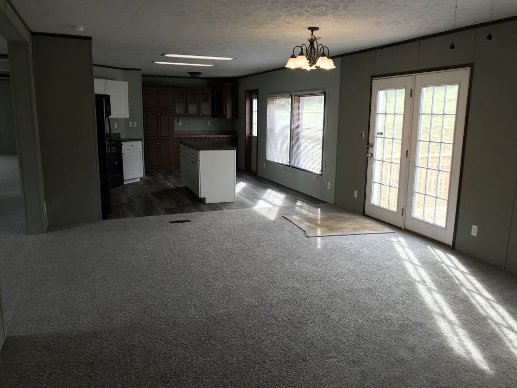 157 Buckner Road Philadelphia, TN 37846 - Photo 6 of 30 a view of a livingroom with a ceiling fan and window