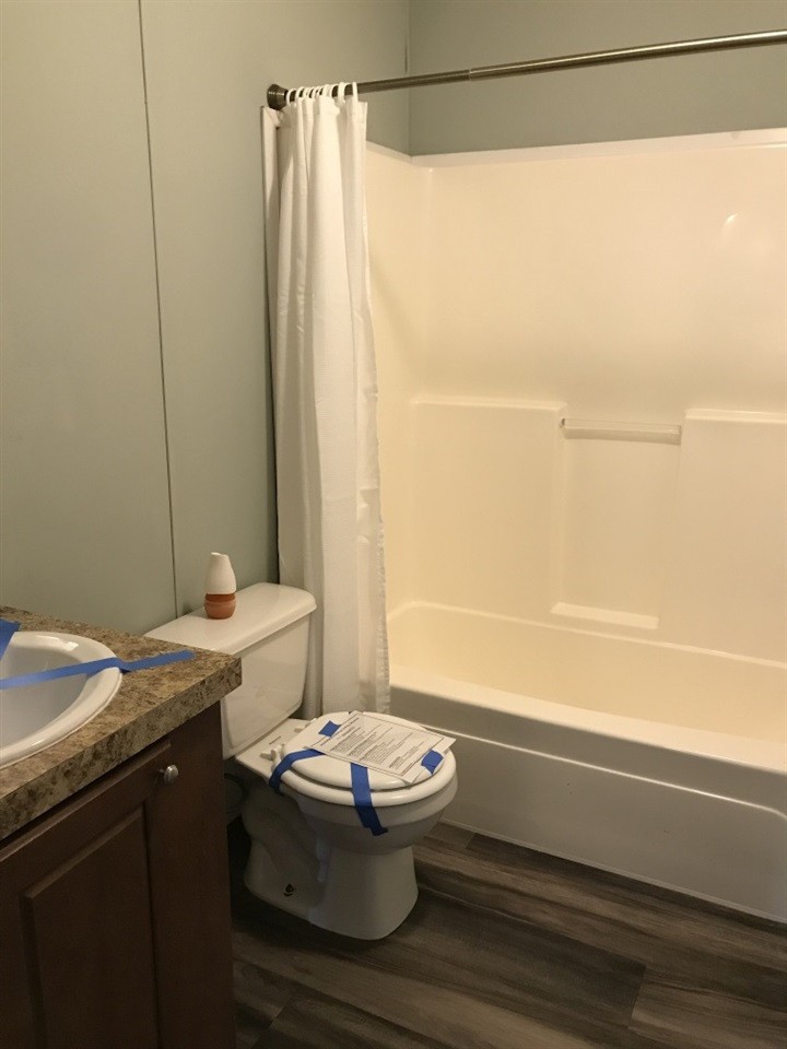 157 Buckner Road Philadelphia, TN 37846 - Photo 8 of 30 a bathroom with a granite countertop sink toilet and shower