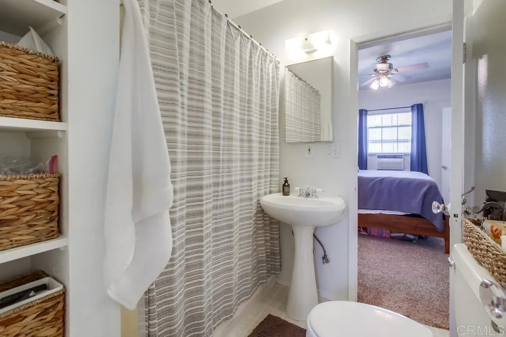 4217 Third Avenue San Diego, CA 92103 - Photo 13 of 16 a bathroom with a sink a toilet and shower