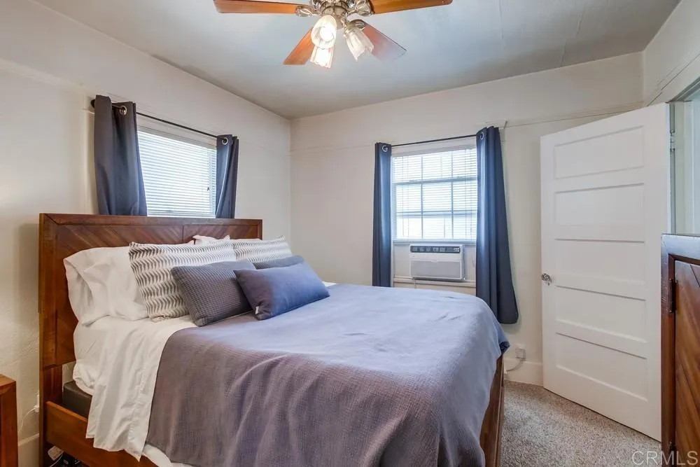 4217 Third Avenue San Diego, CA 92103 - Photo 16 of 16 a bedroom with a bed and a window