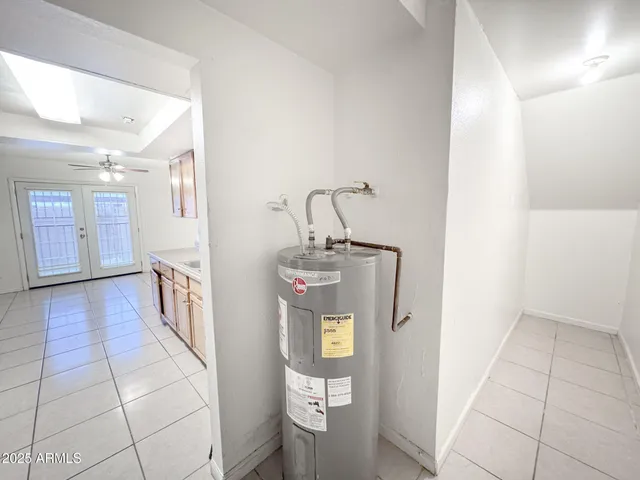 a kitchen with granite countertop cabinets stainless steel appliances and a counter space