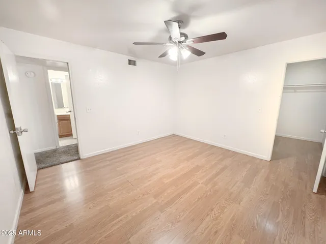 a view of a hallway with a white walls