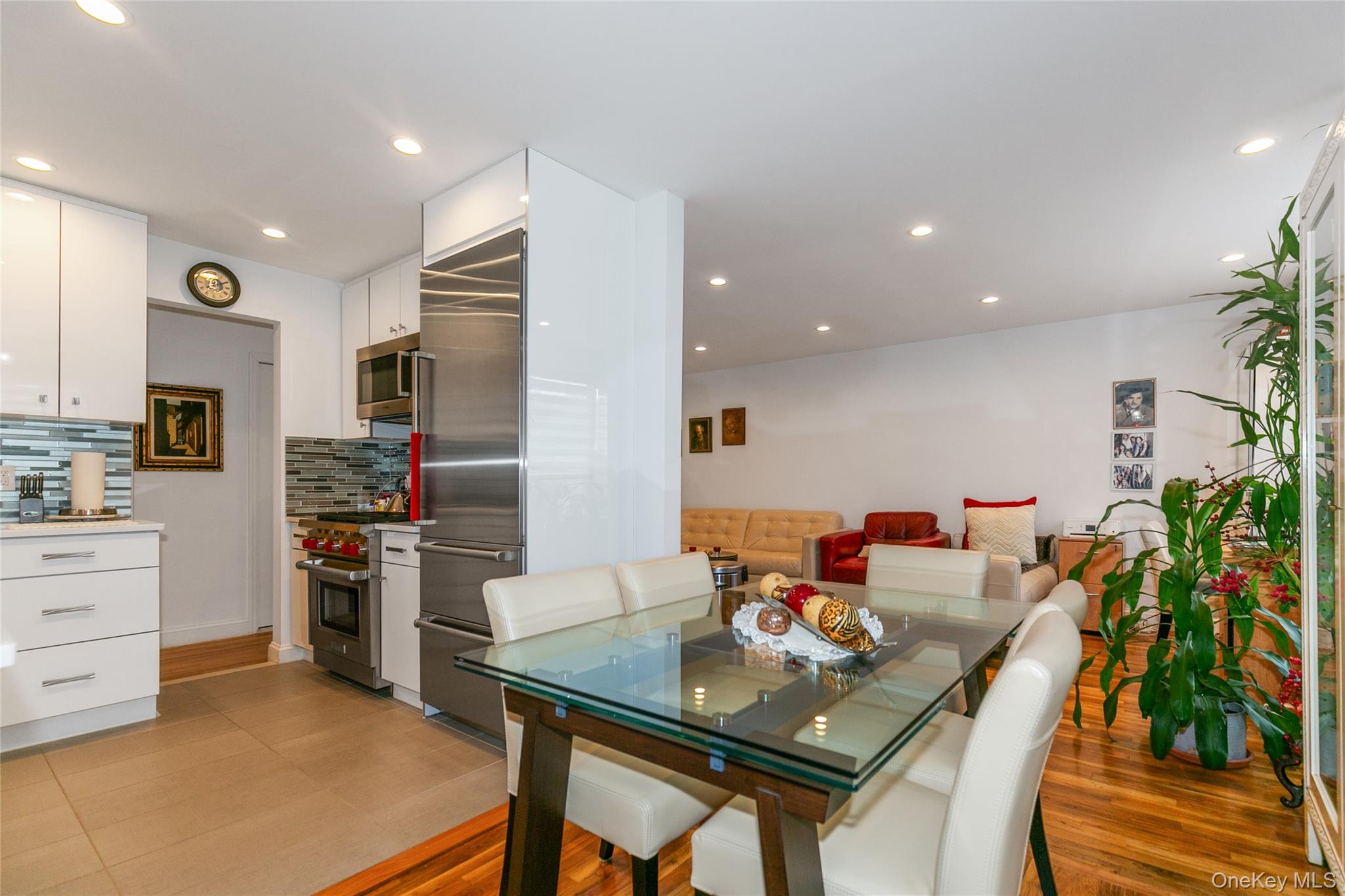 195 South Middle Neck Road, Unit 2H Great Neck, NY 11021 - Photo 11 of 25 a view of a dining room with furniture and a kitchen