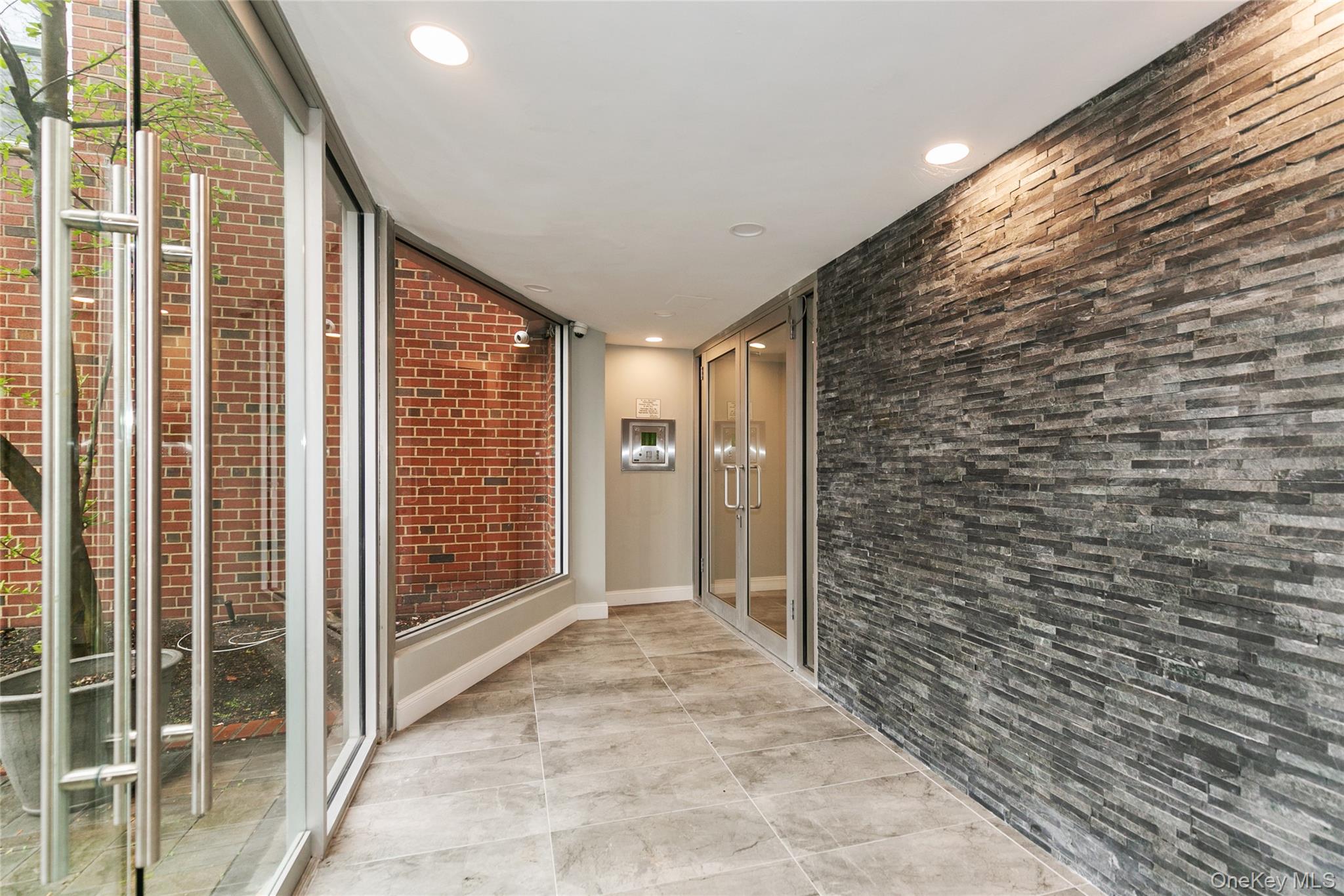 195 South Middle Neck Road, Unit 2H Great Neck, NY 11021 - Photo 2 of 25 a view of entryway with wooden floor