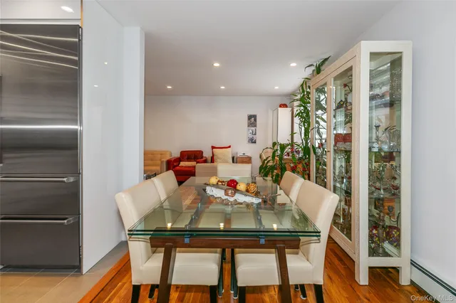 a view of a dining room with furniture and a chandelier