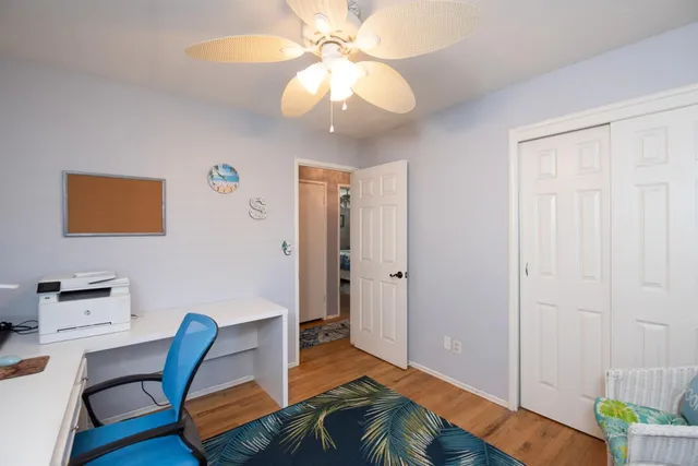 a workspace with furniture and wooden floor