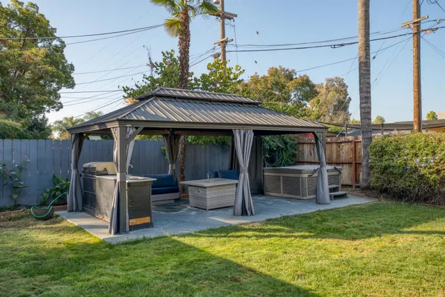 a view of a terrace with chairs and a fire pit