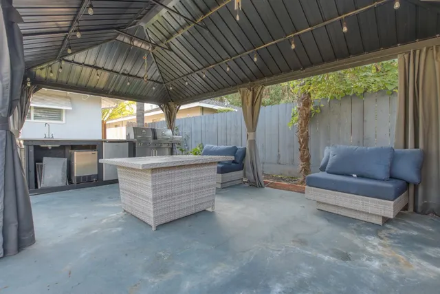 a living room with furniture and a roof deck
