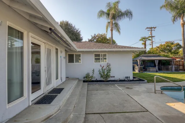 a front view of a house with a garden