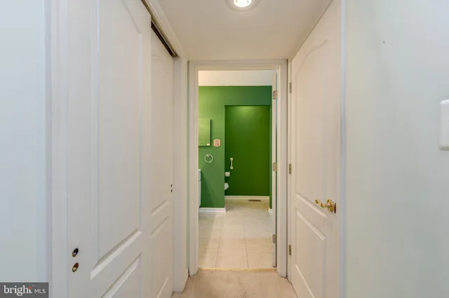 a view of a bathroom from a hallway