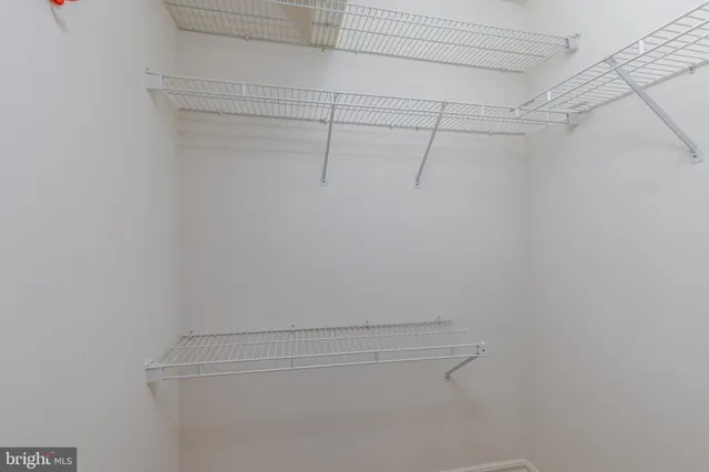 a view of a room with racks on the wall