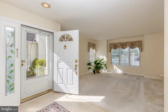 a view of an entryway with wooden floor