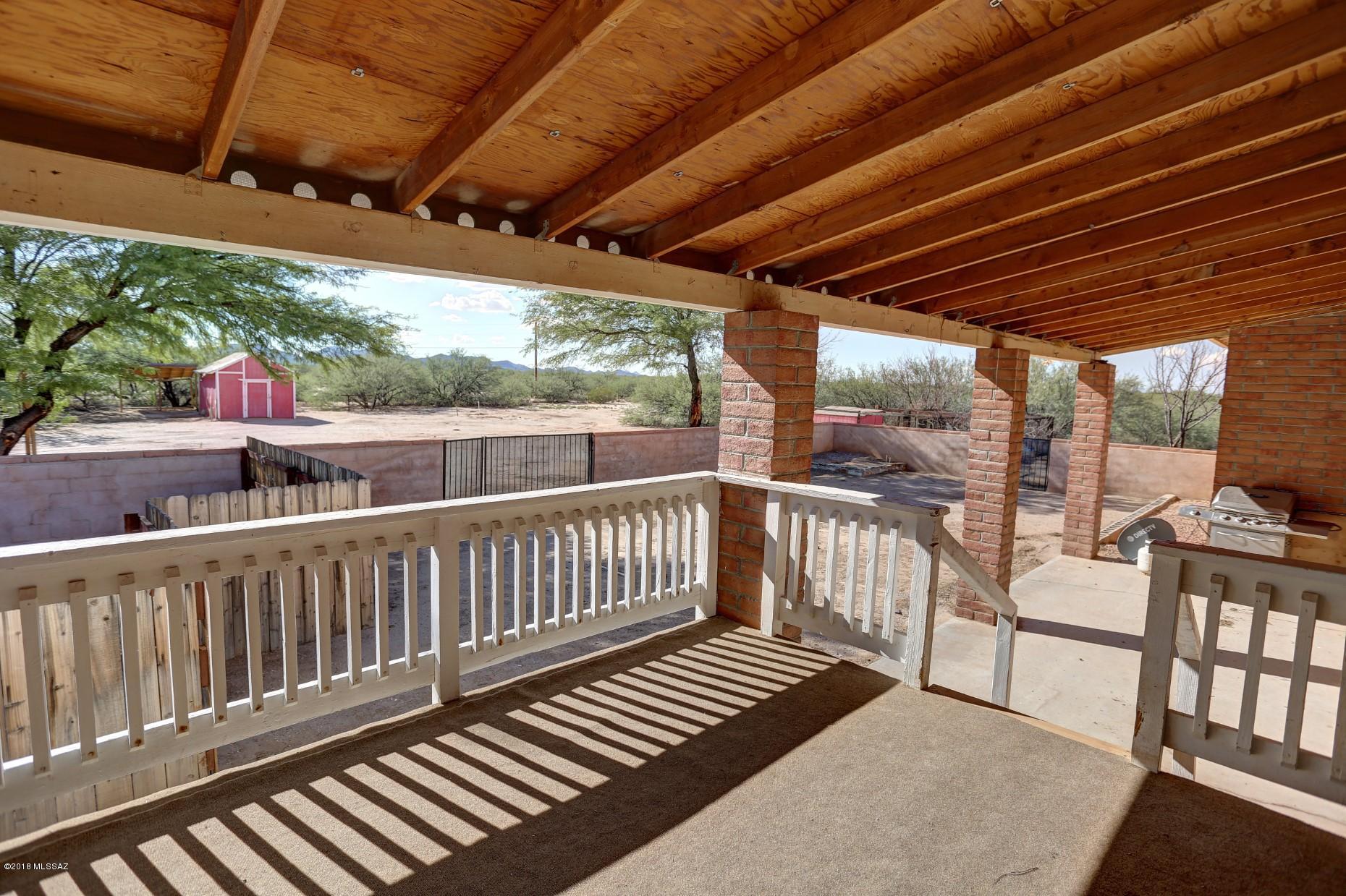5851 South Avra Road Tucson, AZ 85735 - Photo 5 of 46 a view of a two chairs in the balcony