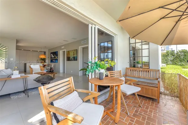 a outdoor space with patio the couches and a dining table with chairs