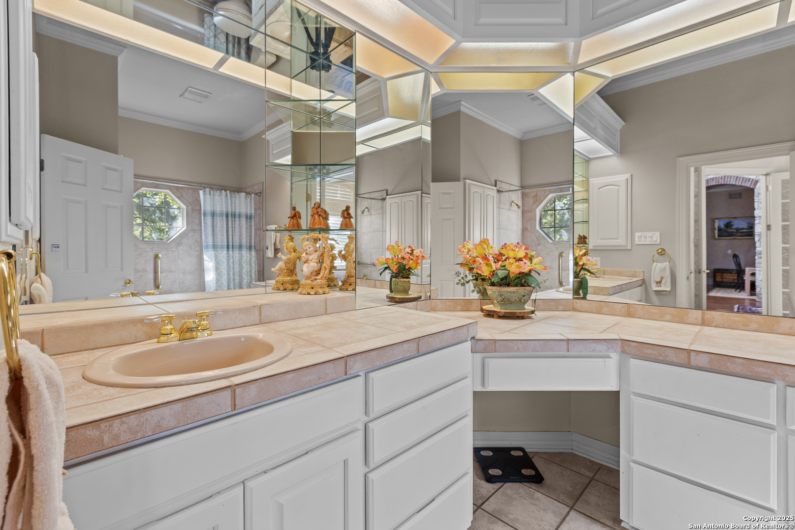 8040 Rolling Acres Trail Fair Oaks Ranch, TX 78015 - Photo 35 of 65 a bathroom with a sink and a mirror