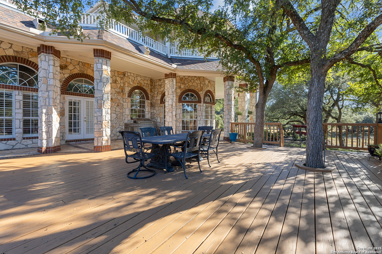 8040 Rolling Acres Trail Fair Oaks Ranch, TX 78015 - Photo 52 of 65 a view of a house with a patio and a yard