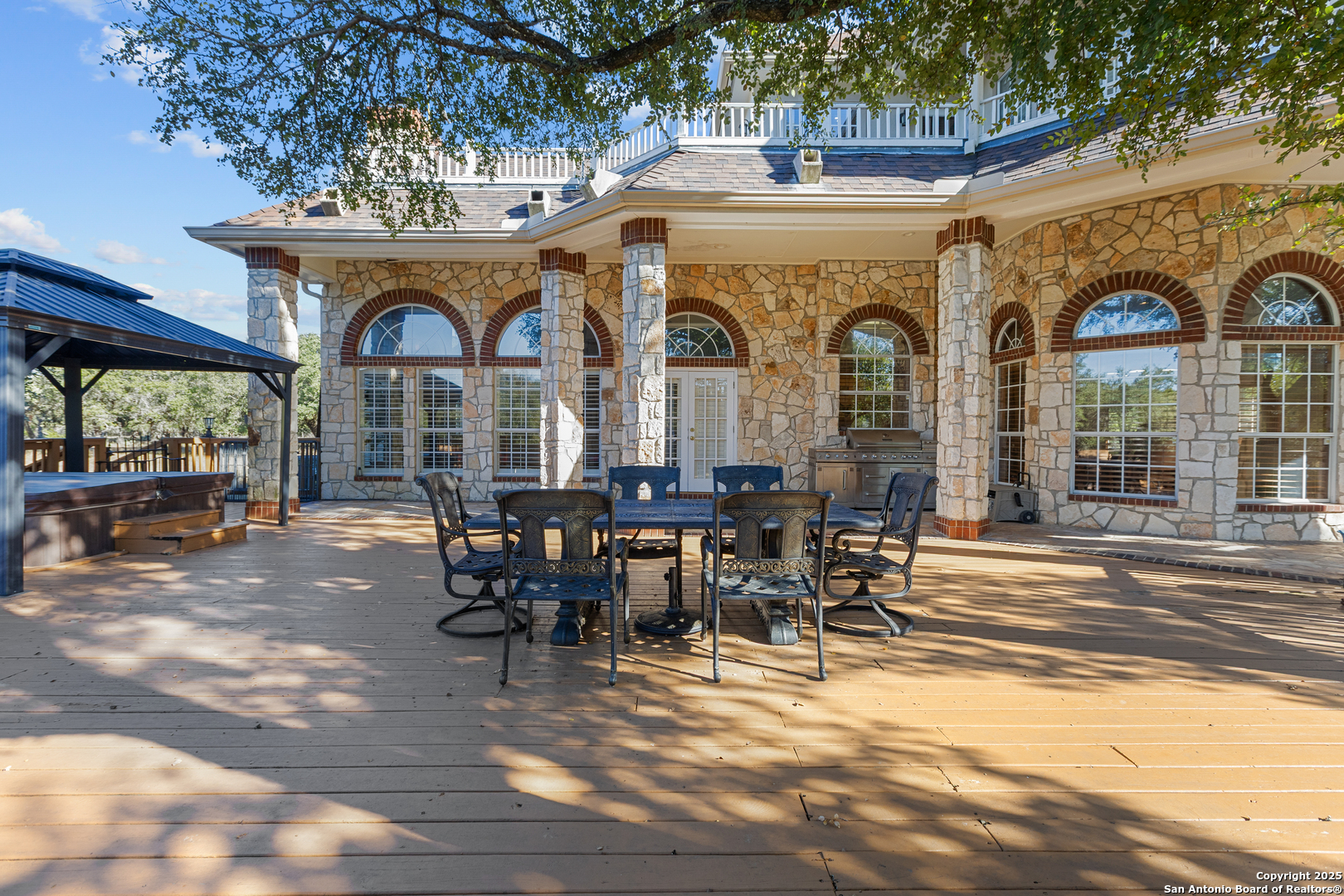 8040 Rolling Acres Trail Fair Oaks Ranch, TX 78015 - Photo 54 of 65 a view of a patio with table and chairs near a yard