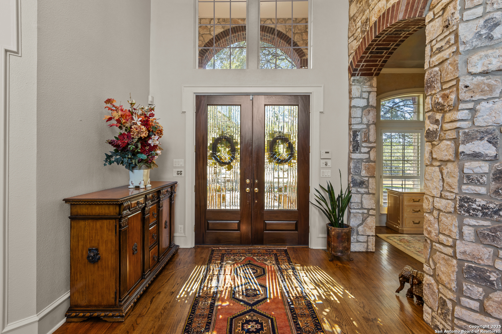 8040 Rolling Acres Trail Fair Oaks Ranch, TX 78015 - Photo 10 of 65 a view of a entryway door with wooden floor