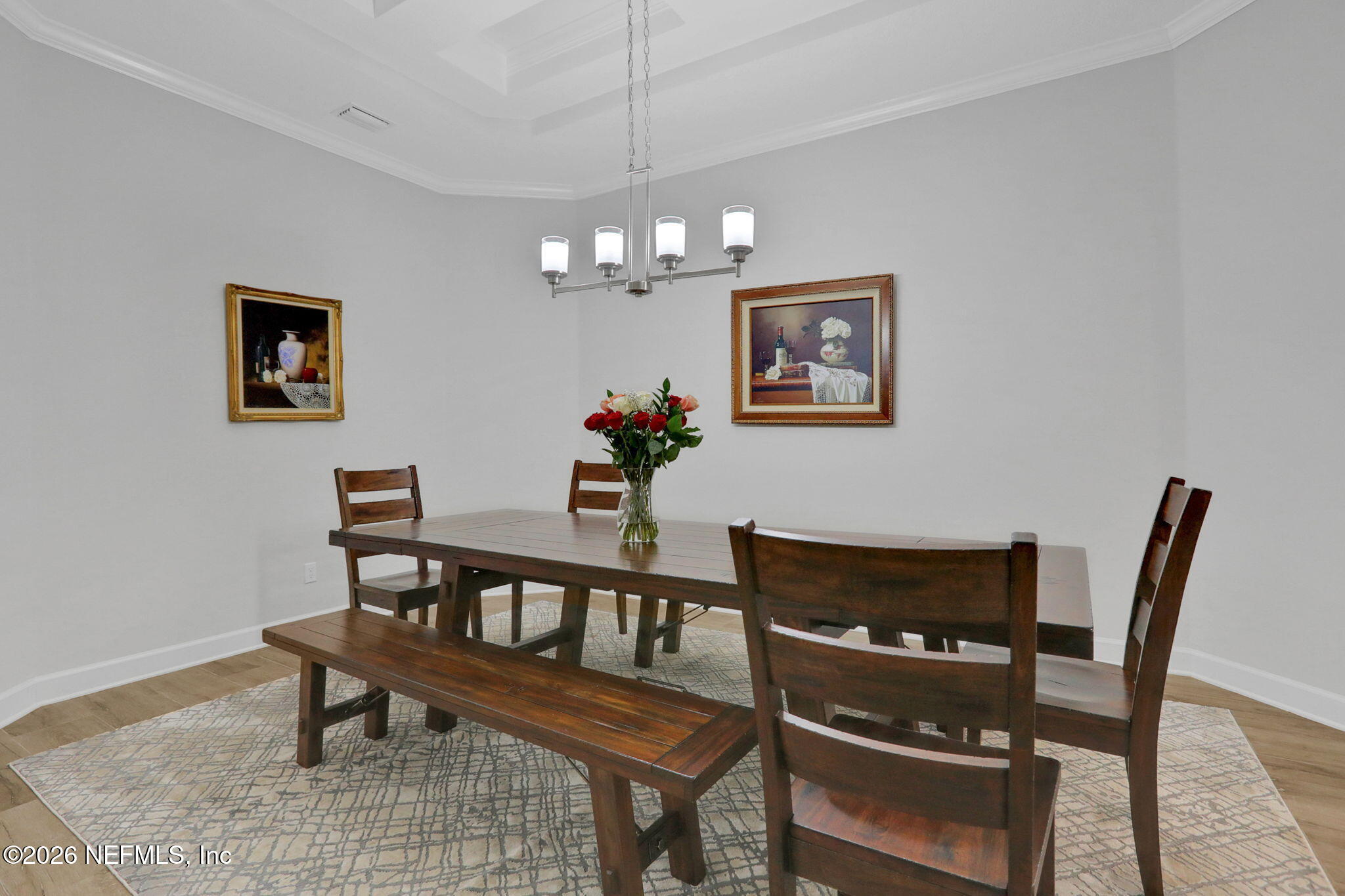4460 Barkoskie Road Jacksonville, FL 32258 - Photo 12 of 80 a view of a dining room with furniture and wooden floor