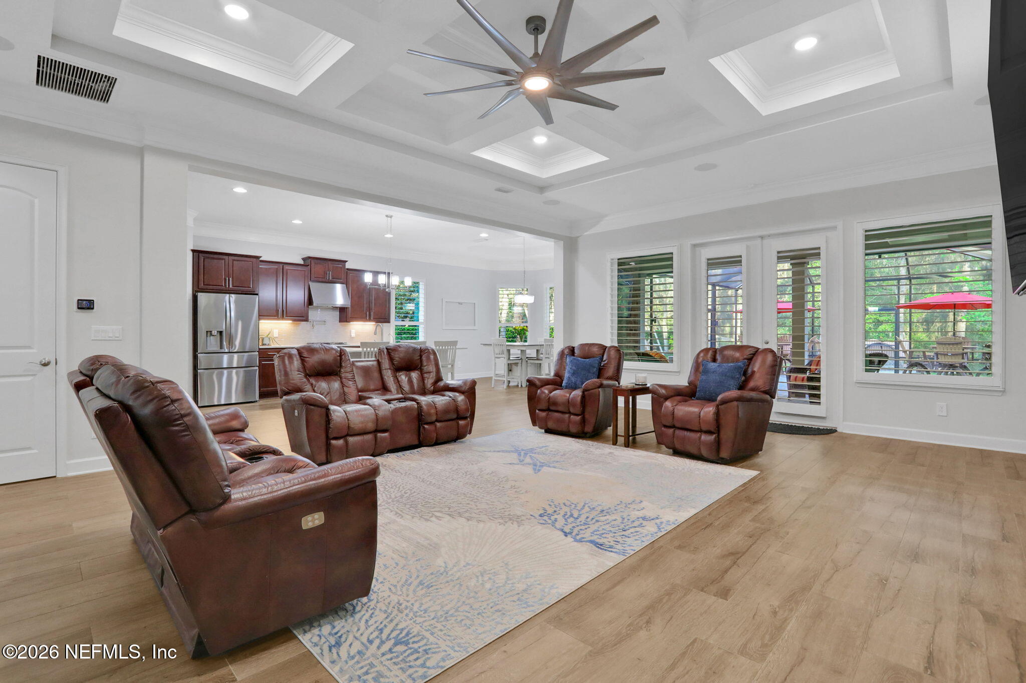 4460 Barkoskie Road Jacksonville, FL 32258 - Photo 14 of 80 a living room with furniture and a large window
