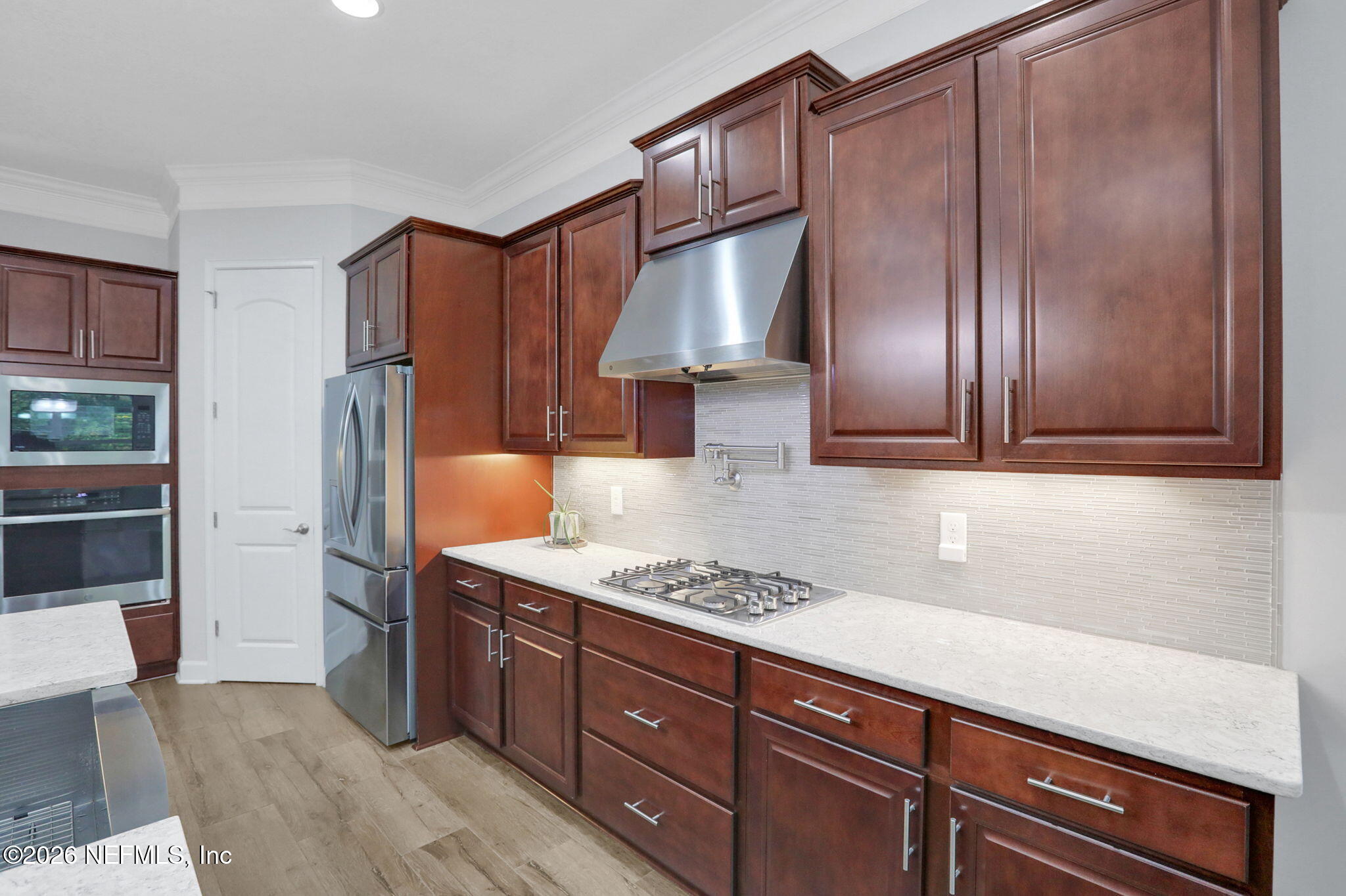 4460 Barkoskie Road Jacksonville, FL 32258 - Photo 18 of 80 a kitchen with stainless steel appliances granite countertop a refrigerator and a sink