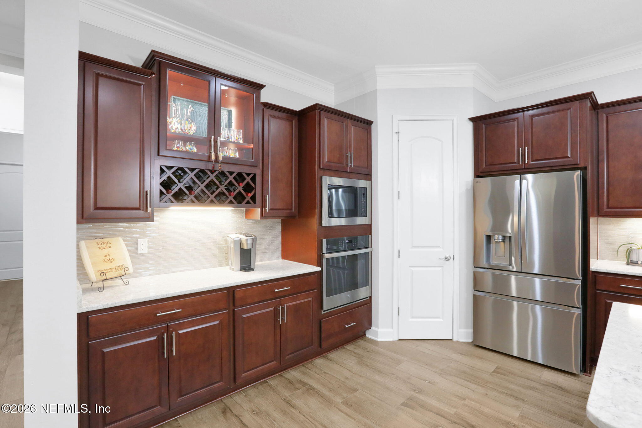 4460 Barkoskie Road Jacksonville, FL 32258 - Photo 19 of 80 a kitchen with stainless steel appliances granite countertop a refrigerator and a sink