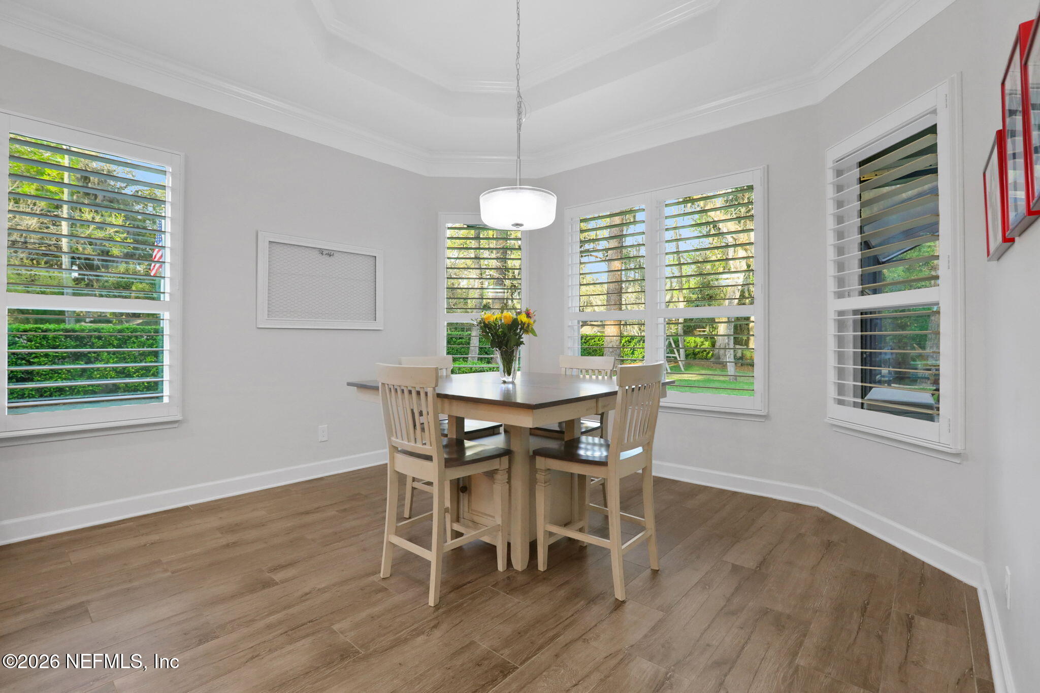 4460 Barkoskie Road Jacksonville, FL 32258 - Photo 24 of 80 a dining room with furniture window outside view and wooden floor